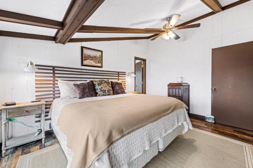 a bedroom with a bed and a ceiling fan at Eagle's Nest in Franklin