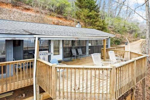 a house with a deck with chairs and a stove at Eagle's Nest in Franklin