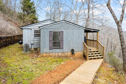 a small shed with a wooden porch and a wooden ramp at Eagle's Nest in Franklin