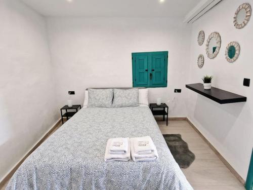 מיטה או מיטות בחדר ב-APARTAMENTO CON TERRAZA Y BARBACOA