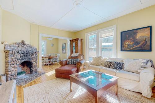 a living room with a couch and a fireplace at A Villager's Dream in North Conway