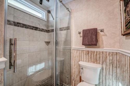 a bathroom with a shower and a toilet at The Bird House in Dillard