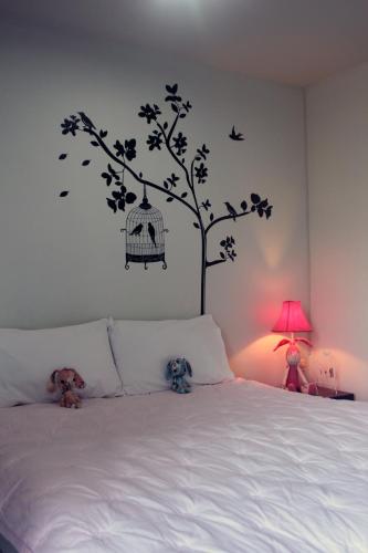 Ένα ή περισσότερα κρεβάτια σε δωμάτιο στο Cozy Rabbit Hotel