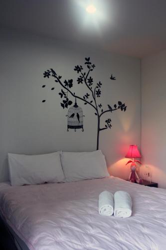 Ένα ή περισσότερα κρεβάτια σε δωμάτιο στο Cozy Rabbit Hotel