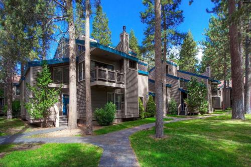 an exterior view of a house with trees at Bear Lake Hideaway condo in South Lake Tahoe