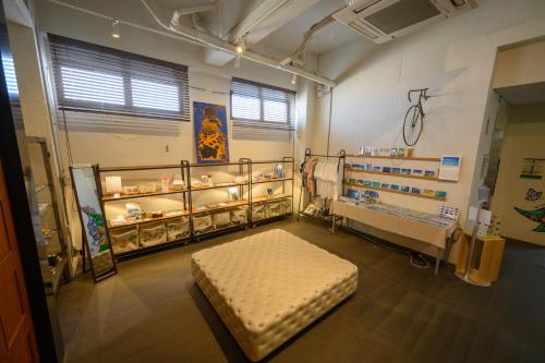 a hospital room with a bed and shelves of medicines at Hotel Emerald Isle Ishigakijima in Ishigaki Island