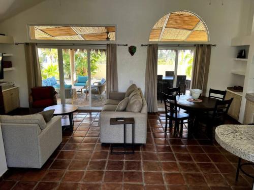 a living room with a couch and a table at FREE CAR W/ Private House & Ocean View in El Bedito