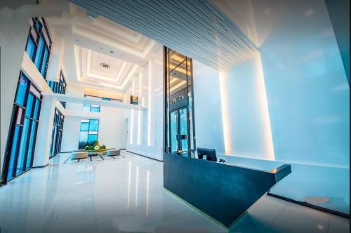 an office lobby with blue lighting and a reception desk at Duplex Town House at EcoBotanic Near Legoland with Netflix and KTV System in Nusajaya
