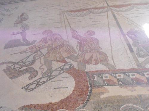 a painting of two men on a stage on a wall at Guest House La Casetta in Piazza Armerina
