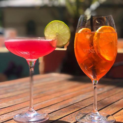 two cocktails sitting on top of a wooden table at Allawah Bendigo in Bendigo