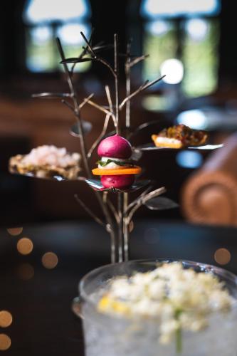 a vase with a fruit arrangement on a table at Viceroy Bali in Ubud