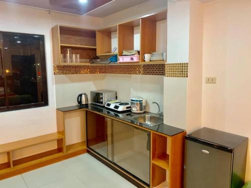 a kitchen with a counter and a sink in it at FLOROTEL II in General Santos