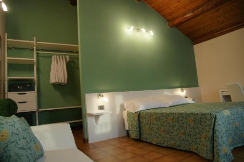 Postel nebo postele na pokoji v ubytování Locanda Grego