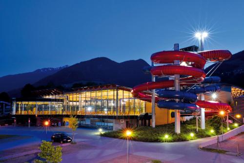 a building with a water slide in front of it at Hotel Cafe-Zillertal in Strass im Zillertal