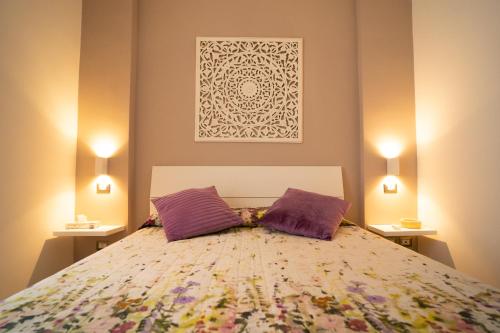 Säng eller sängar i ett rum på Appartamento Piazza Anco Marzio