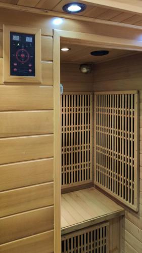 a sauna with a control panel on the wall at Bornemisza Kúria Wellness Resort in Tiszabecs