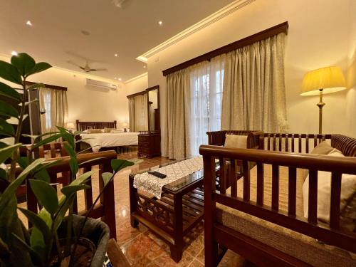 Кровать или кровати в номере Rosewood By The Beach Goa