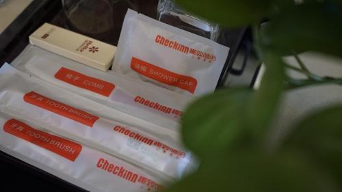 a pile of white toothbrushes in a drawer at Guangzhou City Inn Hotel Apartment Changgang in Guangzhou