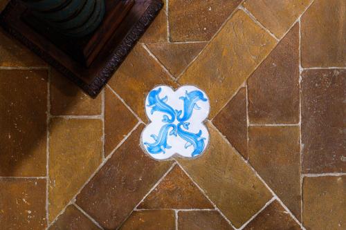 a heart shaped cookie on a tile floor at Duprè Apartment in Siena