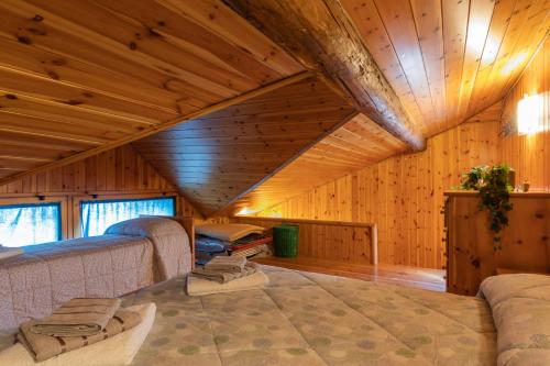a room with two beds in a wooden cabin at New apartment in Bormio - Centrale 20 in Piatta