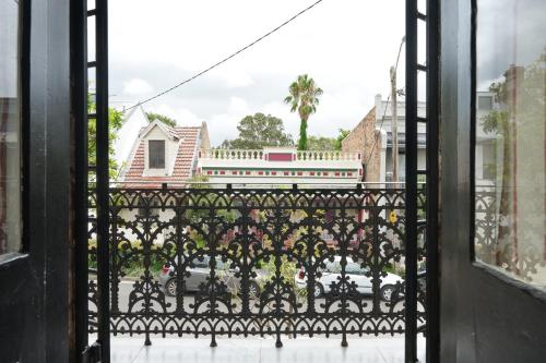a view of a train from a window at Redfern Classic Terrace - Parking and Balcony in Sydney