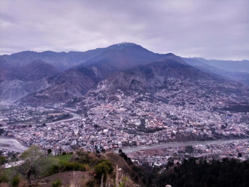 an aerial view of a city in the mountains at Adults Only! Kashmir Eagle Heights Cottage & Restaurant by LMC in Muzaffarabad