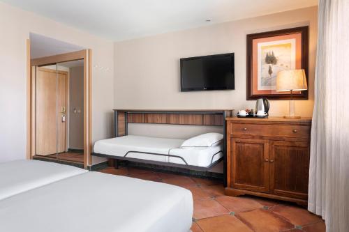 Ένα ή περισσότερα κρεβάτια σε δωμάτιο στο Meliá Sol y Nieve