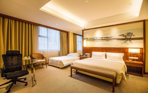 a hotel room with two beds and a desk at Atour Hotel Wangfujing Ave Xinjiekou Nanjing in Nanjing