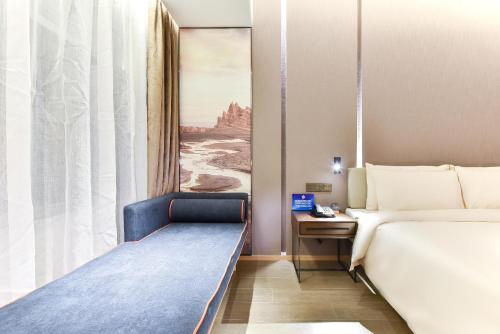 a hotel room with two beds and a window at Atour Hotel Beijing Linkong New International Exhibition Center in Shunyi