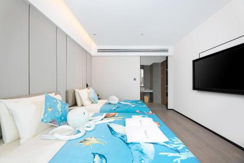Μια τηλεόραση ή/και κέντρο ψυχαγωγίας στο Atour Hotel Changsha Pedestrian Street IFC Center