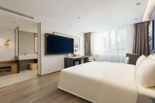 TV a/nebo společenská místnost v ubytování Atour Hotel Dalian Airport