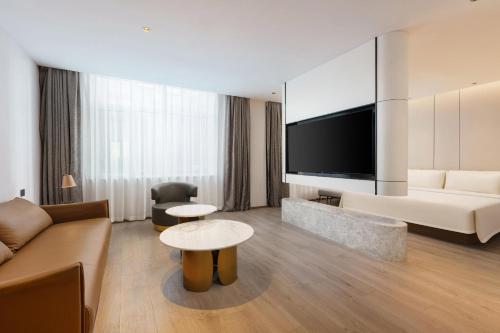 TV a/nebo společenská místnost v ubytování Atour Hotel Dalian Airport