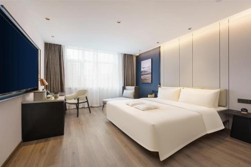 Postel nebo postele na pokoji v ubytování Atour Hotel Dalian Airport