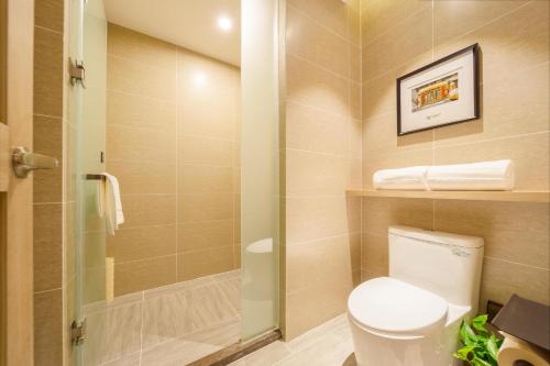a bathroom with a toilet and a shower at Atour Hotel Harbin Convention and Exhibition Center Nongken in Harbin