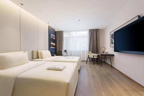 TV a/nebo společenská místnost v ubytování Atour Hotel Dalian Airport