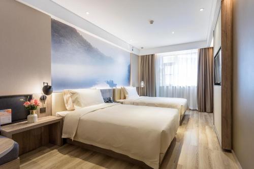 Atour Hotel Changsha IFC Centerにあるベッド