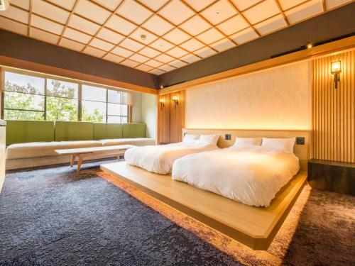 Ένα ή περισσότερα κρεβάτια σε δωμάτιο στο Kurofune Hotel
