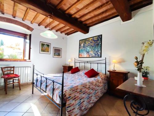 Postel nebo postele na pokoji v ubytování I Girasoli San Gimignano Apartments