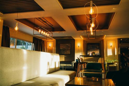 a living room with a couch and a table at Eurohotel Diagonal Port in Barcelona
