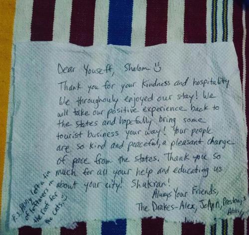 a handwritten letter on top of a towel at DAR Casa Plasa Grande CHEFCHAOUEN in Chefchaouene