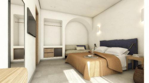 a bedroom with a bed and a table and two windows at Asimina Hotel in Fira