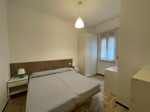 Posteľ alebo postele v izbe v ubytovaní Appartamenti con giardino e posto auto per famiglie
