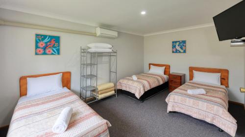 Ένα ή περισσότερα κρεβάτια σε δωμάτιο στο Kempsey Powerhouse Motel