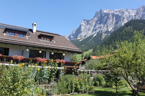 a house with a view of a mountain at Haus Alpenblume in Ehrwald