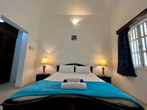 Postel nebo postele na pokoji v ubytování Villa Marina -By The Beach Goa