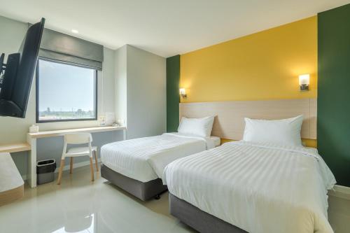 พิลโล่ อินน์ ฉะเชิงเทรา Pillow Inn Chachengsaoにあるベッド