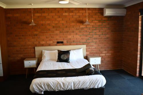 Ένα ή περισσότερα κρεβάτια σε δωμάτιο στο Berrigan Motel