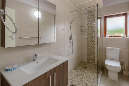 a bathroom with a sink and a shower and a toilet at San Lameer Villa 1939 - 2 Bedroom Classic - 4 pax - San Lameer Rental Agency in Southbroom