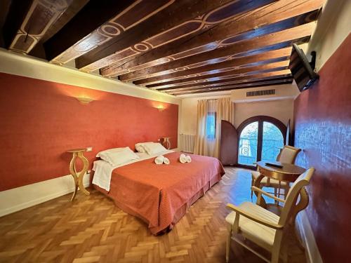 Ένα ή περισσότερα κρεβάτια σε δωμάτιο στο Ca' Giorgia