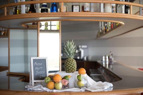 a bunch of fruit on a counter with a pineapple at Seth Santo Tomás in Santo Tomás